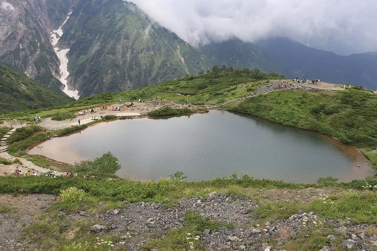 Happo Pond above Hakuba in summer, with the Hakuba mountains behind