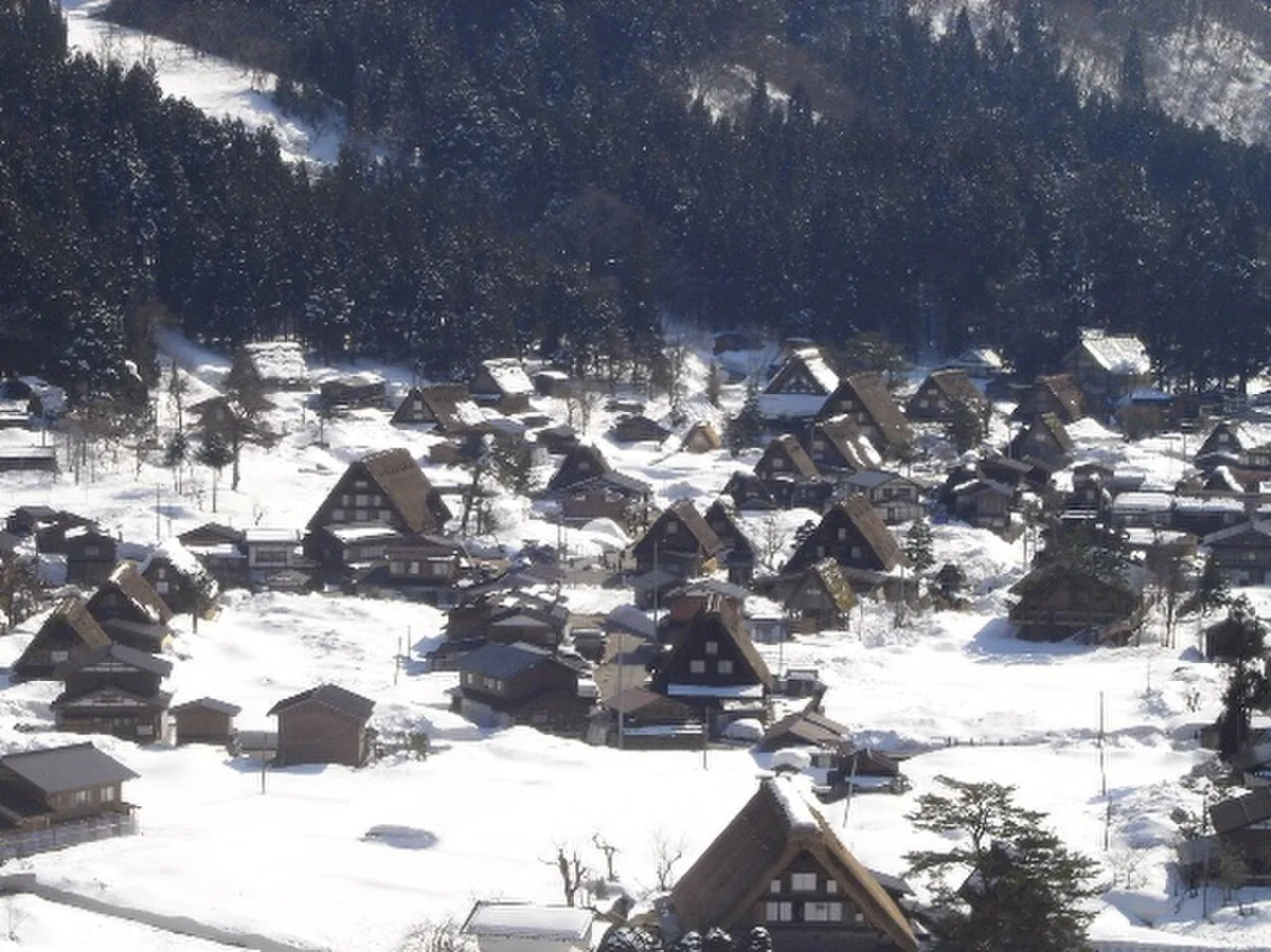 Snow-covered thatched gassho-style farmhouses in Ogimachi, Shirakawa-go, in March
